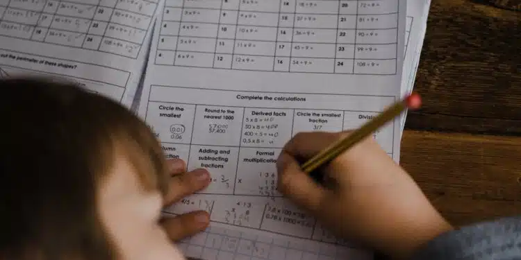 toddler writing indoors